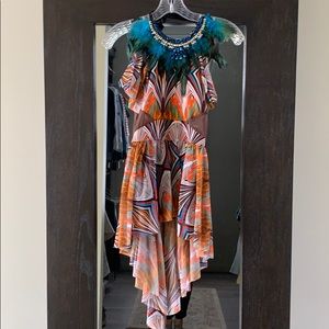 Colorful ethnic girls dance costume with feather neck piece.